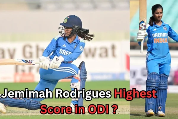 Jemimah Rodrigues playing a cricket shot and raising her bat to celebrate her highest ODI score of 123 runs, wearing the Indian women's cricket team blue jersey.