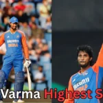 Tilak Varma celebrating his highest score for India, wearing the blue Dream11 India jersey and raising his bat during a cricket match.