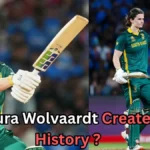 The image features South African cricketer Laura Wolvaardt in action on the cricket field. It showcases her playing, with one image showing her batting and another with her raising her helmet. The text on the image reads: "Laura Wolvaardt Creates History?