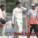 A male cricket player in a white uniform walks off the field holding his face in apparent discomfort, accompanied by two support staff members dressed in training gear. One staff member carries a helmet and towel, while the other carries a bat and a kit bag. The scene appears to take place during a match, with spectators blurred in the background. Text at the bottom reads: “Shubman Gill’s Freak Injury Shocks?”A male cricket player in a white uniform walks off the field holding his face in apparent discomfort, accompanied by two support staff members dressed in training gear. One staff member carries a helmet and towel, while the other carries a bat and a kit bag. The scene appears to take place during a match, with spectators blurred in the background. Text at the bottom reads: “Shubman Gill’s Freak Injury Shocks?”