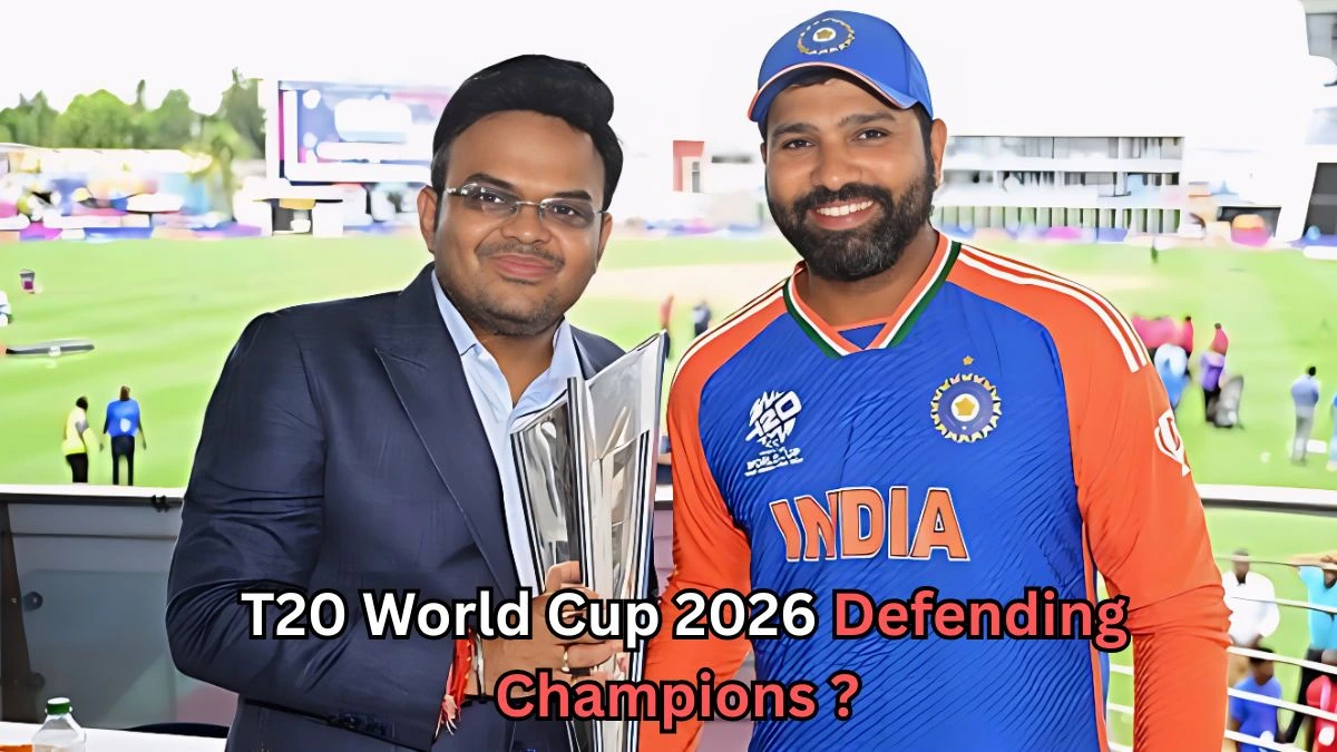 A man in a dark suit holding a cricket trophy stands beside a man wearing an India T20 cricket jersey and cap. Both are smiling at the camera inside a cricket stadium. Text on the image reads: “T20 World Cup 2026 Defending Champions?”