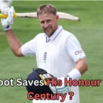 A male cricketer in an England Test uniform smiles while holding a cricket bat over his shoulder and a helmet in his other hand, standing on a grassy field. Text on the image reads: “Joe Root Saves His Honour with a Century?
