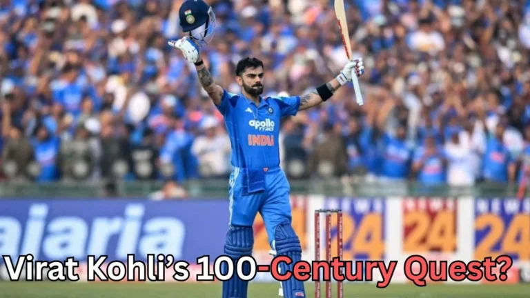 A cricketer in a blue uniform stands on the field holding his helmet in one hand and his bat raised in the other while facing a cheering crowd in the stadium. Stumps are visible behind him. Text at the bottom of the image reads “Virat Kohli’s 100-Century Quest?