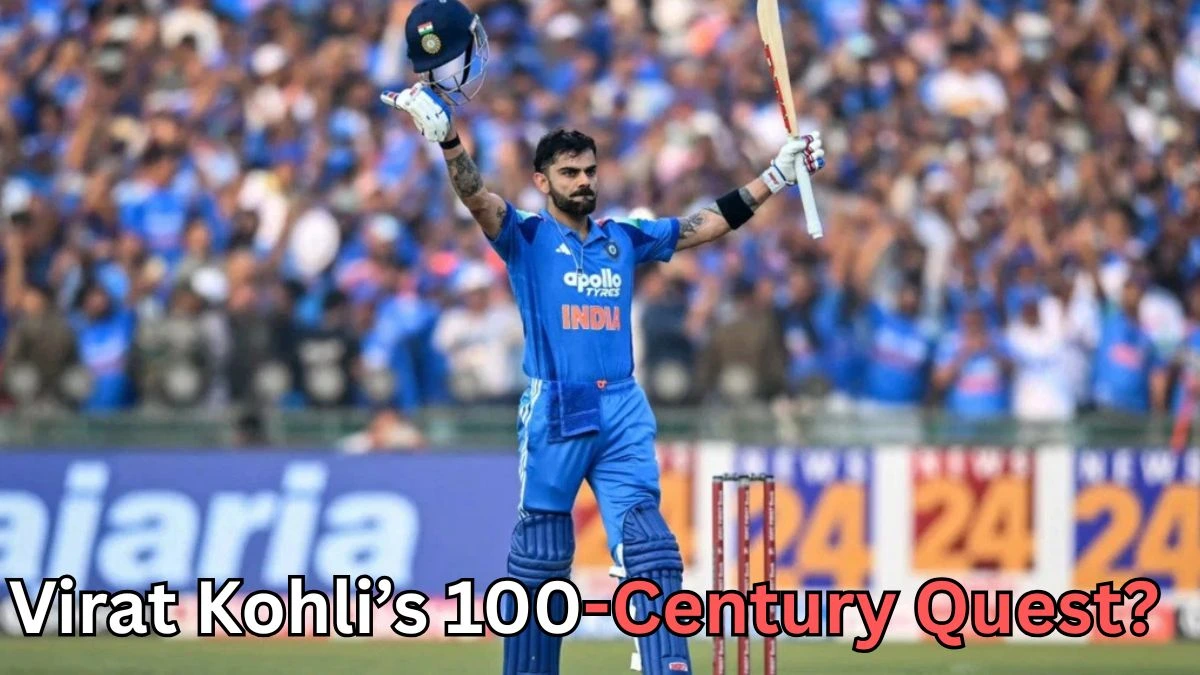 A cricketer in a blue uniform stands on the field holding his helmet in one hand and his bat raised in the other while facing a cheering crowd in the stadium. Stumps are visible behind him. Text at the bottom of the image reads “Virat Kohli’s 100-Century Quest?